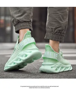 Detail view of mint green mesh sneakers featuring a stylish wavy hollow thick sole