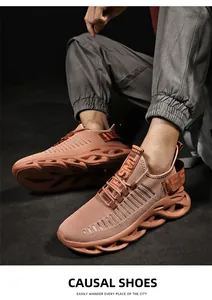 Macro detail of breathable coral orange mesh upper and hollow blade cushioning sole