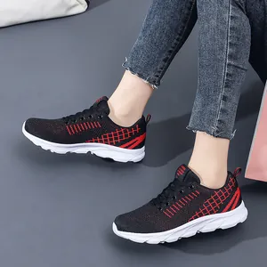Women's breathable black mesh running sneakers with red stripe and cushioned sole