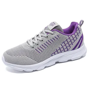 Breathable gray knitted running shoes for women with stylish purple accents and white soles