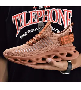 Macro view of caramel brown mesh sports shoe with breathable fabric and hollow blade sole