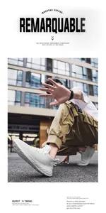 Outdoor shot of white mesh running shoes with geometric anti-slip soles on a street model