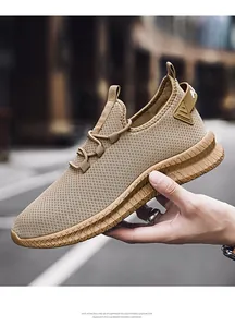 Macro shot of breathable fly-knit khaki upper and thick EVA anti-slip outsole