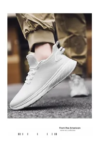 Detail of white mesh running shoe featuring breathable texture and SIKTE pull tab