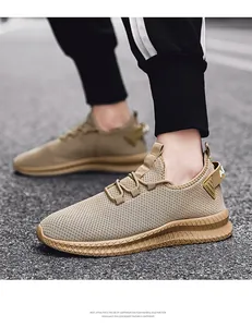 Detail of khaki breathable mesh running shoe with thick EVA lightweight sole and rear pull tab