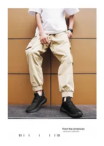 Close-up of black mesh running shoes with non-slip outsoles on a male fashion model