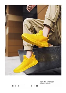 Close-up of bright yellow mesh running shoes with breathable texture for men
