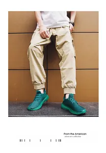 Outdoor shot of green breathable knit running shoes on a fashion model in casual wear