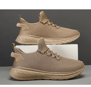 Detailed macro view of breathable khaki mesh fabric and thick cushioned sole on mens sneakers