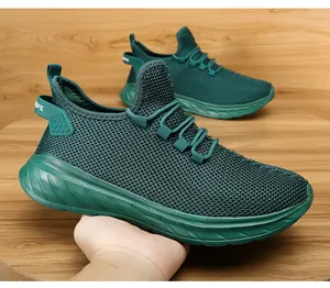 Detail view of dark green breathable mesh running shoe with thick non-slip rubber sole