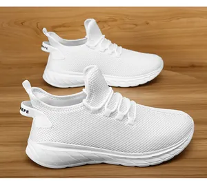 Close-up of white breathable mesh running shoes with AEFE heel tab on wooden floor