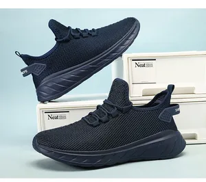 Detail view of navy blue mesh running shoes on a clean minimalist blue background