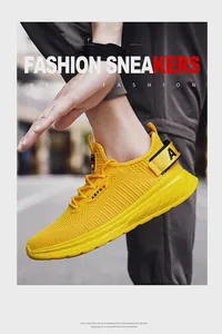 Detail of yellow mesh running shoe featuring lightweight EVA sole and breathable fabric texture
