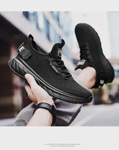 Detail of breathable mesh upper and lightweight EVA foam sole on black athletic running shoe