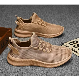 Macro detail of breathable mesh fabric and chunky textured sole on khaki sneakers