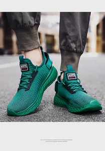 Detailed close-up of neon green breathable knit running shoes with textured EVA shock soles