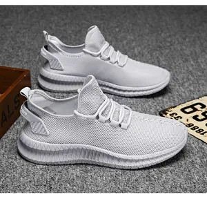 Detailed side view of breathable light grey mesh sneakers with wavy cushioned soles