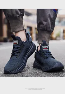 Close-up of breathable mesh upper and durable laces on dark blue sneakers