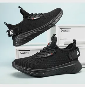 Detailed view of black breathable mesh running shoes with thick cushioned soles and laces