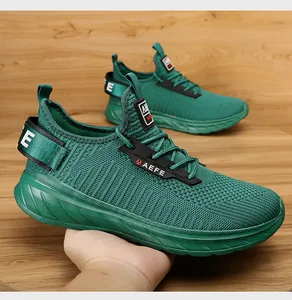 Close-up of green breathable mesh running shoes with a durable non-slip sole