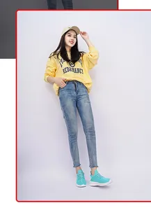 Fashion lifestyle view featuring mint green knit sneakers paired with yellow sweatshirt