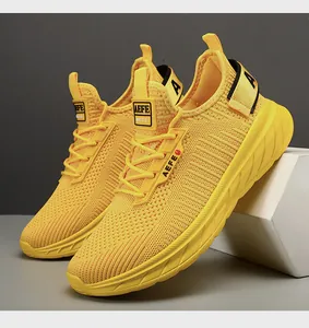 Detail of breathable mesh upper and EVA cushioned sole on yellow running sneakers