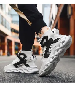 Close-up of men's breathable sneakers featuring black and white contrast and mesh texture