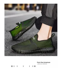 Detail van groene mesh outdoorsneakers met wit TEQ-logo en ademende textielstructuur