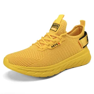Lightweight yellow breathable mesh running shoes for men with shock-absorbing thick soles