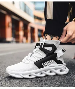 Detail of white mesh running shoe with black geometric accents and wavy hollow shock sole
