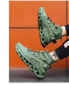 Army green breathable mesh sneakers with chunky wave-hollowed sole and letter webbing detail