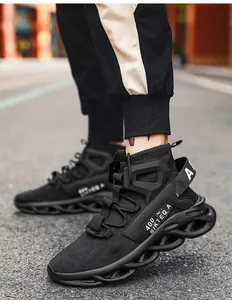 Detail of all-black techwear sneakers featuring wave-shaped hollow shock-absorbing soles