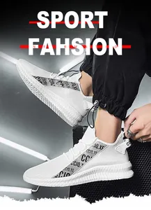 Detail view of white breathable mesh sneakers with grey accent straps and thick textured soles