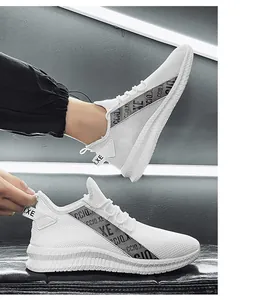 Detail of white mesh sneakers showing breathable fabric and non-slip thick sole