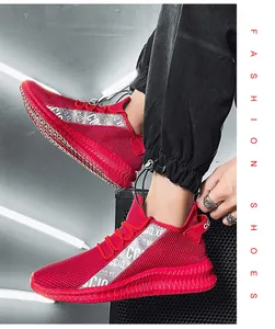 Detail of red mesh running shoe for men featuring CC IQ.XE lettered strap and jagged sole