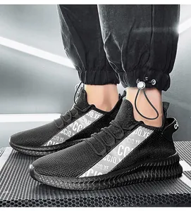 Detail of black mesh running shoe with CCJQ.XE letter print and wavy thick sole