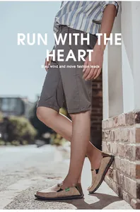 Close-up of khaki canvas slip-on shoes with woven soles and grey shorts on street