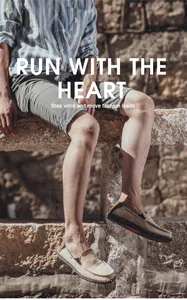 Outdoor shot of khaki canvas slip-on loafers for men with black woven soles and green tag