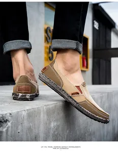 Detail of men's casual canvas shoes featuring textured soles and contrast stitching
