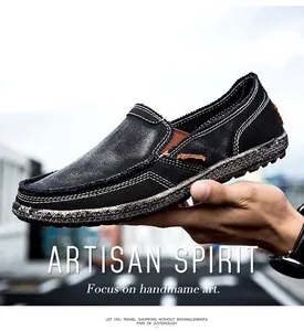 Close-up of black canvas slip-on loafers featuring contrast stitching and rustic jute sole