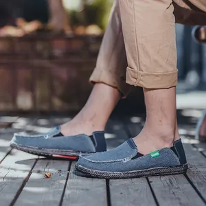 Classic blue canvas slip-on loafers with raw edges and durable rubber soles for men