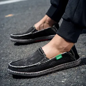 Mocasines de lona negra para hombre con costuras en contraste y suela de goma exterior