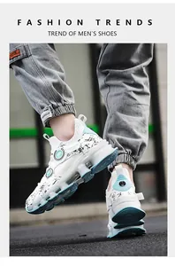 Detailed side view of white and blue men's athletic sneakers with splatter patterns