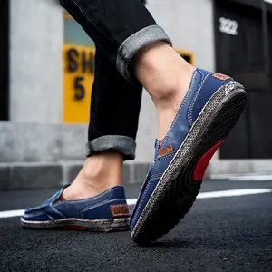 Men's navy blue canvas loafers with white stitching and non-slip rubber soles for walking
