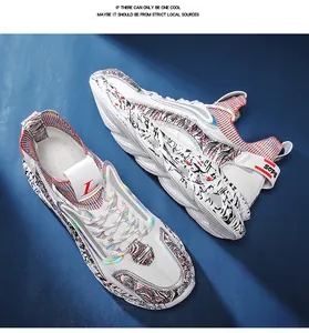 Detailed top view of white sports sneakers featuring graffiti texture and laser accents