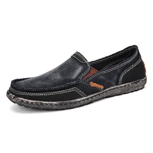Men's blue denim slip-on canvas shoes with brown suede accents and textured sole