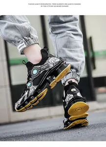 Street-style low angle shot of breathable black sneakers with bold yellow outsoles