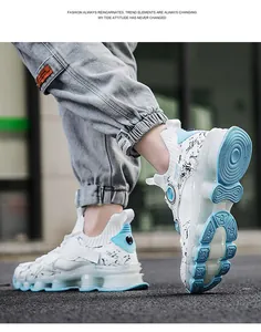 Detailed side view of white breathable mesh sneakers with blue accents and chunky soles
