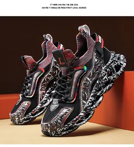 Close-up of men's athletic sneakers with black knit mesh and graffiti-patterned thick soles