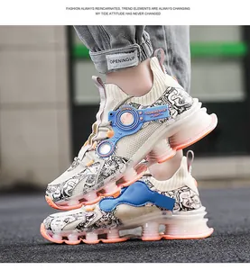 Detail of fly-knit sports shoe with graffiti print and orange gradient air-cushion sole
